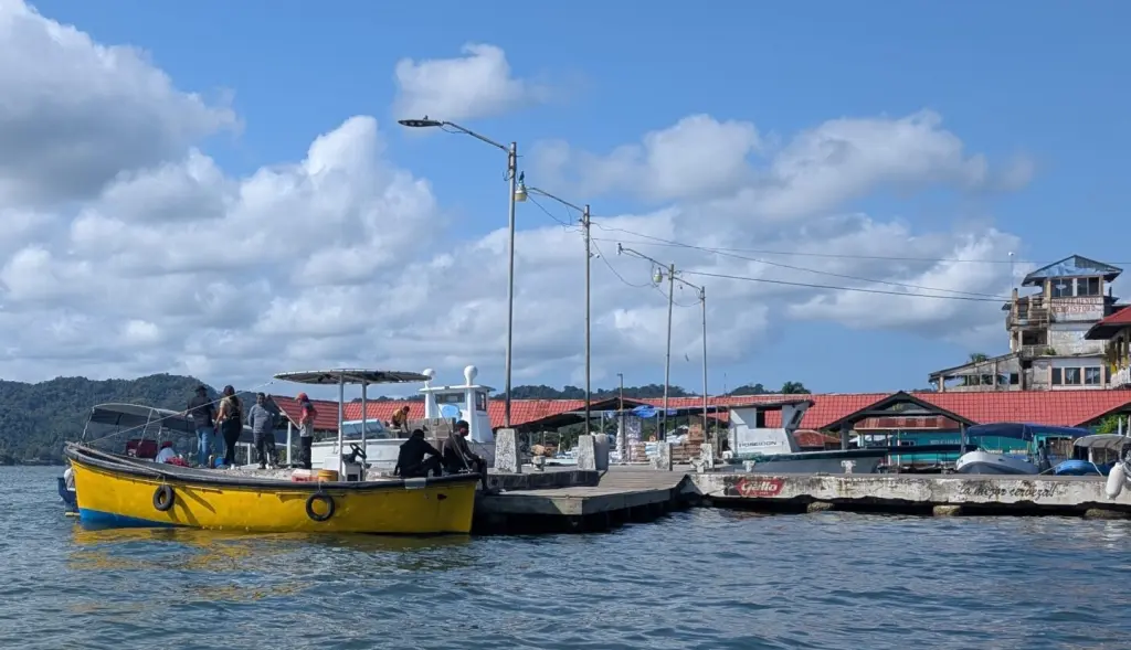 Floating Down The Rio Dulce For A Week, Discovering Guatemala’s Hidden Gem! Boat At Docks At Livingston on Rio Dulce Guatemala