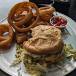 Classic Rock Burger And Onion Rings From Portland Burger, Portland, OR, Dated May 23, 2024 Classic Rock Burger And Onion Rings From Portland Burger, Portland, OR, Dated May 23, 2024