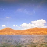 Looking back towards Puno, Peru from Uros Islands Looking back towards Puno, Peru from Uros Islands
