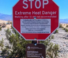 Warning Sign In Multiple Languages At Mesquite Flat Sand Dunes, Death Valley, CA Warning Sign In Multiple Languages At Mesquite Flat Sand Dunes, Death Valley, CA